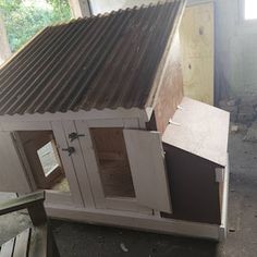 a chicken coop is shown in the process of being built