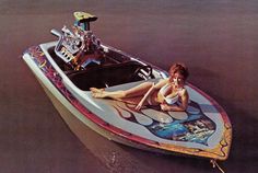 a woman sitting on top of a motor boat in the middle of the water with her legs spread out