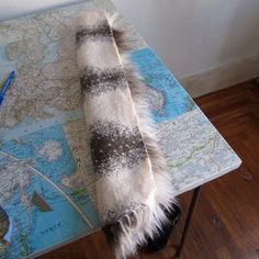 a table with a map and some fur on it