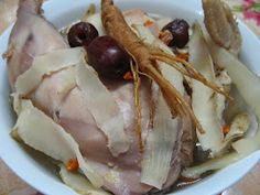 a white bowl filled with meat and veggies