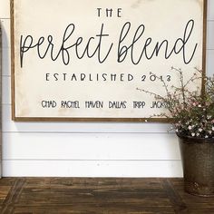 a sign that says the perfect blend established 2013 on it next to a potted plant