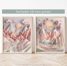 two paper art prints with mountains and trees on them, one is pink and the other is