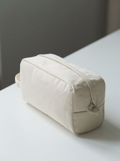 a white bag sitting on top of a table