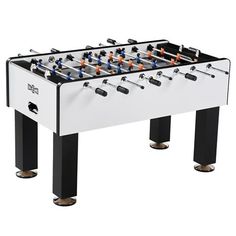 an image of a foosball table that is white and black