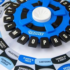 there is a blue and black wheel on top of the board game nameplates