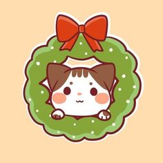 an animal sticker with a bow on it's head, sitting in front of a wreath