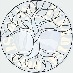 a circular stained glass window with a tree in the center