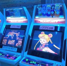 three arcade machines with cartoon characters on them