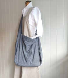 A really lovely, large made in quality cotton chambray. As it is inspired by a traditional messenger bag, it can be comfortably worn across the body for every day use. We have also made it with handles for the times when you want to hold it like a tote. Very handy indeed. Each bag has it's own unique lining! Fully lined in cotton shirt fabrics, with two internal pockets. The shirts used to line our bags are from quality shirt makers of Jermyn Street, London. Our fabrics are of the highest quality, making it a very strong, versatile bag for any season. It is a really great bag for everyday use....spacious enough to carry books, laptops, etc.... Becomes a lifesaver when you forget to take an extra bag for shopping, as it makes a great shopper too! Also, makes a great baby changing bag! A tru Cotton Tote Shoulder Bag With Pockets, Everyday Cotton Bag With Side Pockets, Everyday Cotton Bags With Side Pockets, Cotton Tote Bag With Side Pockets, Everyday Cotton Shoulder Bag With Side Pockets, Everyday Cotton Crossbody Shoulder Bag, Casual Cotton Crossbody Bag, Casual Gray Hobo Bag For Everyday, Casual Gray Cotton Bag