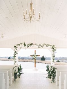 the instagram page on instagram shows an image of a white chapel with greenery