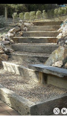 a wooden bench sitting on top of stone steps