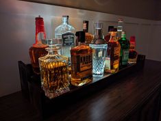 several different types of liquor on a bar