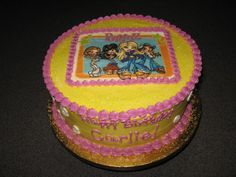 there is a birthday cake decorated with cartoon characters