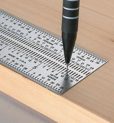 a drill is being used on a ruler