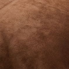 an image of a brown carpet that is very soft and shaggyy in the middle