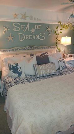 a bedroom with sea themed decor on the walls