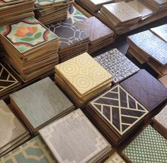 many different colored and patterned tiles on display