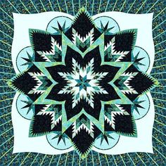 a blue and black flower is featured in this quilting pattern, which has been made with