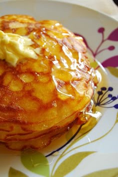 a plate topped with pancakes covered in butter