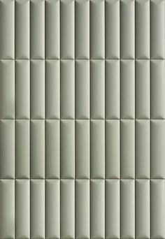 an image of a wall made out of tiles