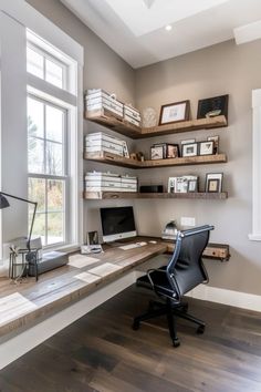 a home office with shelving, desk and chair in front of a large window