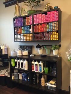 a shelf filled with lots of different types of hair products