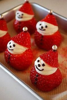 some strawberries are shaped like santa hats