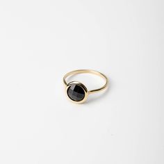 Natural black onyx 14K solid gold ring for women. A delicate black onyx gemstone ring, ideal for stacking for every woman who loves elegance. An excellent choice for an anniversary gift or a Christmas gift for her by Kyklos. 100% handcrafted with love! D E T A I L S ● Metal: 14K solid gold, 14K white gold or 14K rose gold ● Gemstone: Black Onyx, briolette cut ● Stone Diameter: 8mm (0.31in), 10mm (0.4in) and 12mm (0.5in)  R I N G ∙ S I Z I N G For General Reference: ● we use standard US Ring Sizing ● an average women's ring finger is size 6-7 ● each ring is custom made upon order, in any desired size. ● if your ring size is not listed please contact us H O W ∙ T O ∙ O R D E R Choose from the drop down menus the available options (MetalColor-StoneSize, Ring Size) and leave us a note for any Gold Ring For Women, Gold For Women, Solid Gold Ring, Black Onyx Ring, Onyx Gemstone, Valentines Day Gifts For Her, Valentines Gifts For Her, Onyx Ring, Anniversary Gift For Her