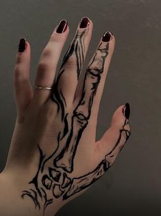 a woman's hand with black ink on it