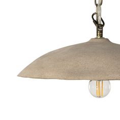 a light hanging from a ceiling fixture with a beige fabric covering on the top and bottom