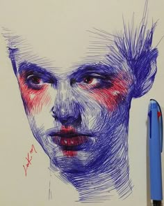 a drawing of a man's face with red and blue ink