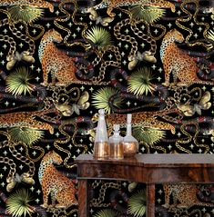 a wallpaper design with leopards and chains on it's black back ground