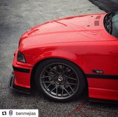 a red sports car parked in a parking lot