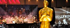 an oscar statue is shown in front of the stage