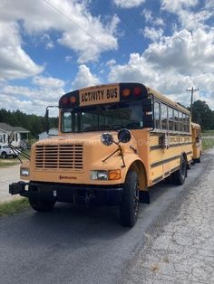 the school bus is parked on the side of the road