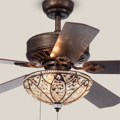 a ceiling fan with a chandelier hanging from it's blades and light fixture