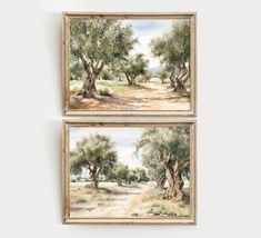 two framed paintings depicting trees and dirt road