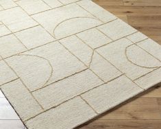 a white rug with an abstract design on it