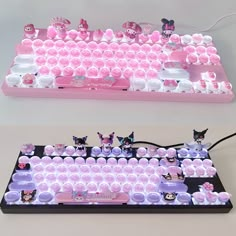 a pink and white keyboard with lots of cats on it