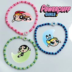 the powerpuff girls beaded bracelets are shown in three different colors and designs