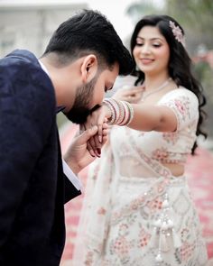 a man and woman standing next to each other