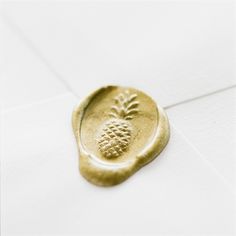 a wax stamp with a pineapple on it