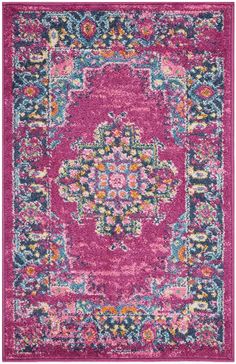 a pink and blue rug with an ornate design on the center, surrounded by multicolored flowers