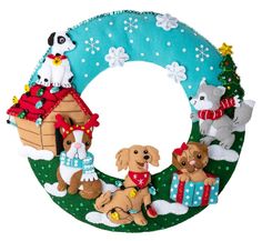 a christmas wreath with dogs and presents on the front is decorated like a letter o