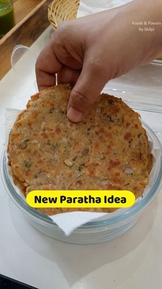 a person placing food on top of a plate with the words new paratha idea