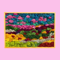 an abstract painting with multicolored flowers in the middle and yellow frame on pink background