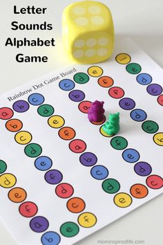 an alphabet game with two gummy bears on it