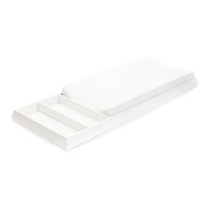 two white trays sitting on top of each other