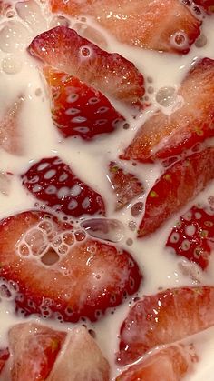 strawberries and milk are mixed together to make a delicious dessert dish for someone's special occasion