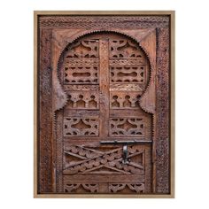 an old wooden door with intricate carvings